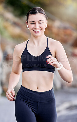 Buy stock photo Runner, fitness and woman running outdoor, bluetooth earphones for music or podcast and happy with workout. Run, active and healthy lifestyle, wellness in nature and listening for training motivation