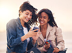 Friends, phone and happy on social media outdoor for interracial creative content, streaming video online or web communication message app. Women, diversity and friendship or reading on smartphone