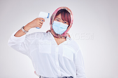 Buy stock photo Muslim woman, covid face mask and thermometer gun on white studio background for marketing, virus and healthcare mockup. Portrait of islam model in hijab with medical thermal scanner for safety