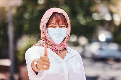 Buy stock photo Success, hijab and woman thumbs up with covid protection on Turkey, Europe holiday walk in town. Yes, agreement and vacation of muslim travel person walking with face mask for corona safety.