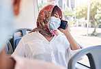 Muslim, phone and bus woman in covid face mask talking of travel safety, compliance and health information or networking Islamic, hijab international girl travel on city transport with cellphone call