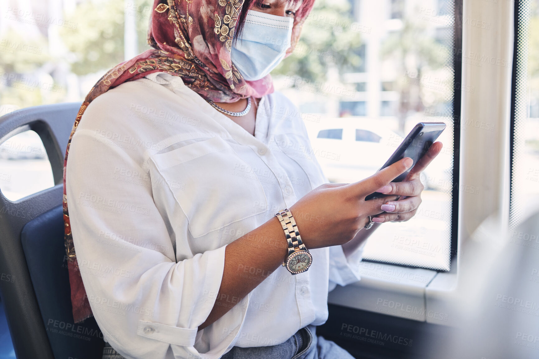 Buy stock photo Covid, transport and smartphone of woman on social media chat, search for news information and reading bus compliance rules. Traffic, travel and muslim girl in face mask using phone for online update