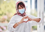 Muslim, woman with hijab and covid, face mask with hand heart in city portrait, health and love outdoor. Compliance, hands and healthcare with safety and Islam, wellness and covid 19 care and safe.