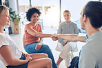 Welcome, handshake and people in counseling for mental health, coping and stress management with support. psychology, community and shaking hands by man and woman in group therapy with medical expert