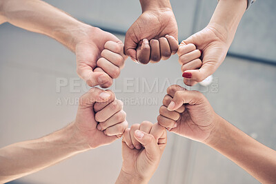 Buy stock photo Motivation, teamwork group or collaboration fist bump for trust, goal and success support below. Zoom workers hands, team building and growth commitment mission, winner vision or solidarity together
