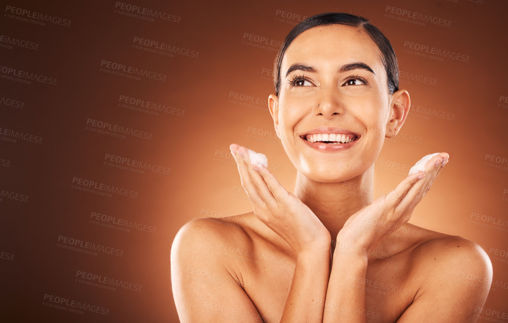 Buy stock photo Skincare, beauty and woman with soap in studio on brown background for luxury spa, wellness and facial cleanse. Cleaning, cosmetics and girl with lotion, foam and cream on hands for face or body care