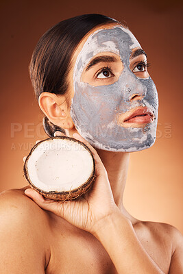 Buy stock photo Skincare, facial and woman with coconut in studio for face, skin and hygiene treatment on brown background mockup. Face, model and girl with face product from nature, nature extract and cleaning