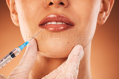 Buy stock photo Beauty, lips and botox with a woman customer in studio on a brown background for plastic surgery. Doctor, trust and collagen with a female client getting an injection in her lip with a syringe