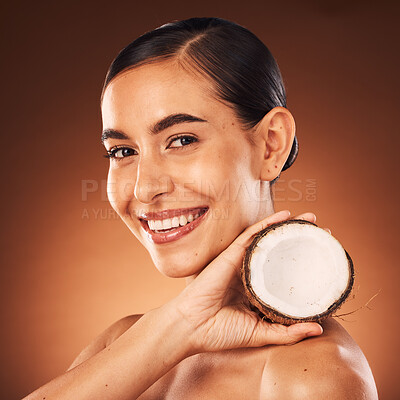 Buy stock photo Coconut, woman and beauty, skincare and portrait, cosmetics and healthy food for diet, aesthetics and body nutrition benefits on studio background. Happy young model, coconut oil and natural wellness