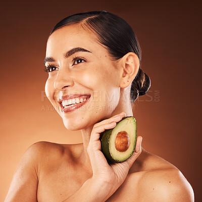 Buy stock photo Beauty, wellness and woman in studio with avocado for diet, healthy eating and skin health on brown background. Skincare, girl and model with fruit, nature and product for cleaning, facial and mask