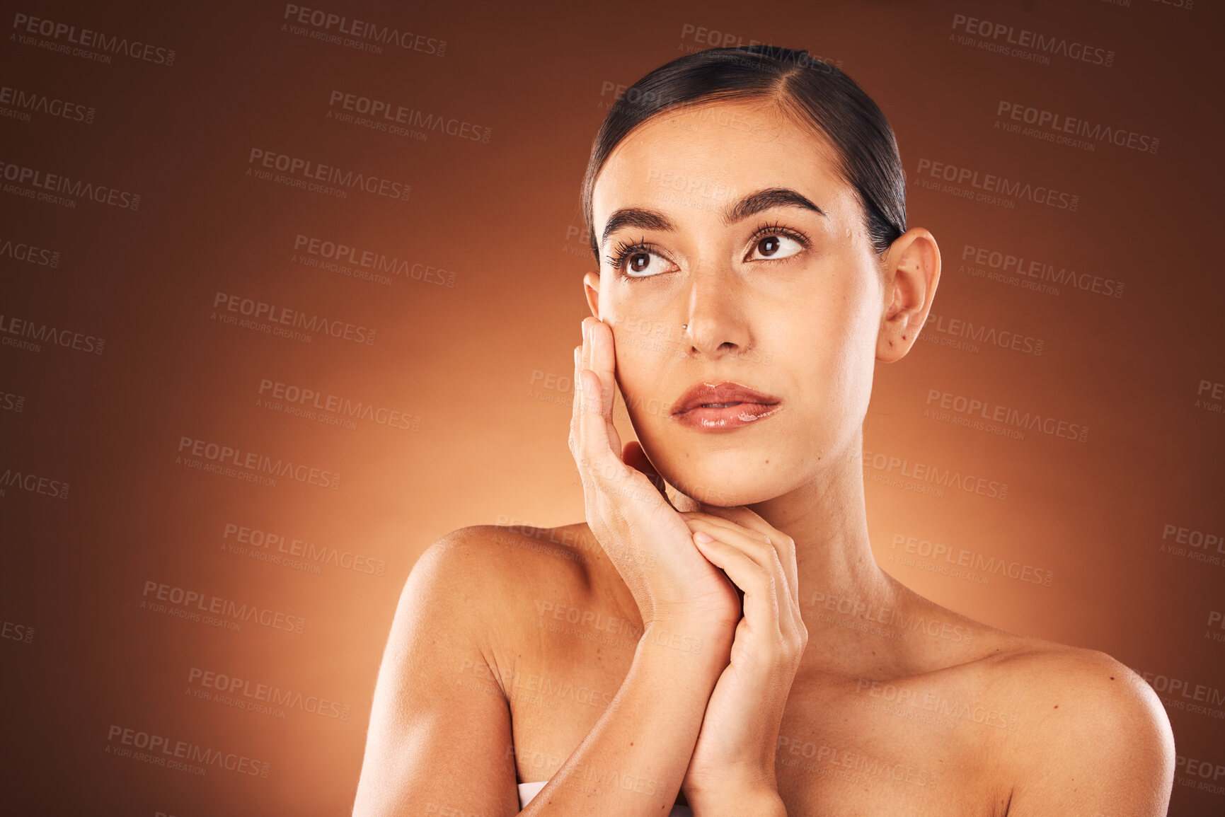 Buy stock photo Idea, skincare and woman with beauty makeup, spa wellness and self love glow against a brown studio background. Cosmetics, marketing and thinking model with luxury cosmetic care and dermatology