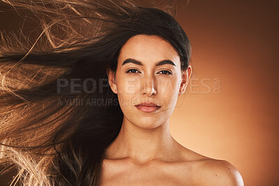 Hair care, beauty and portrait of woman in studio with healthy, long and straight hair style. Health, wellness and face of girl model with keratin or botox hair treatment isolated by brown background
