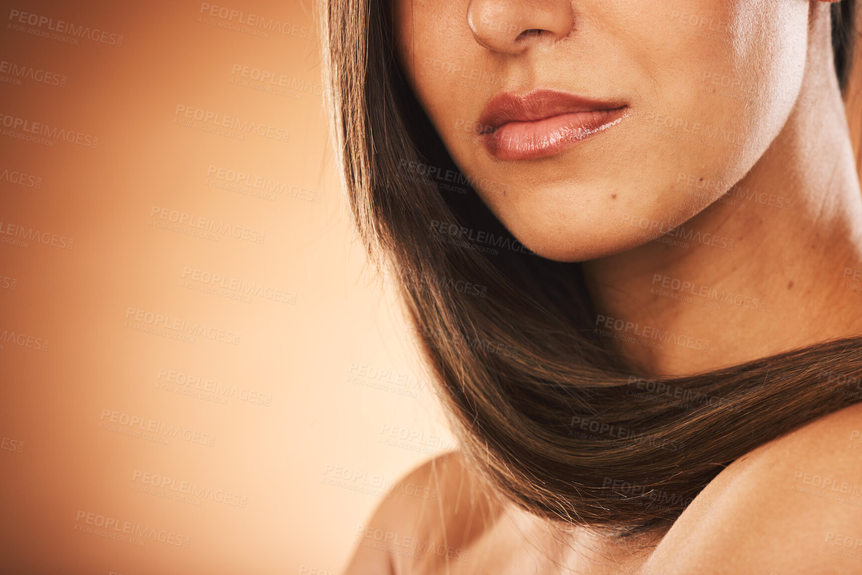 Buy stock photo Beauty, hair care and woman in studio with healthy hair for brazilian, keratin or botox treatment. Health, cosmetic and girl with long and shiny hair style by brown background with mockup space.