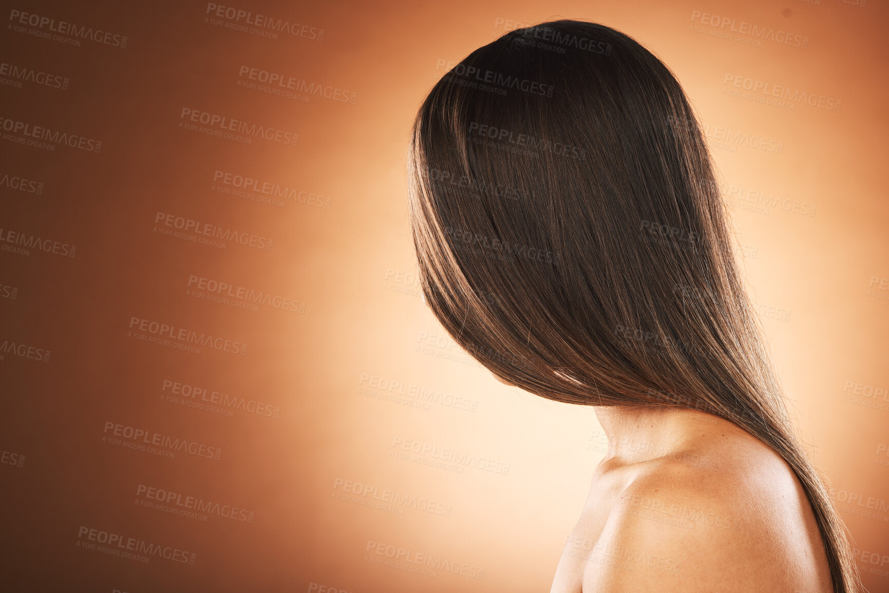 Buy stock photo Hair care, shine and woman marketing a salon, hairdresser mockup and space on a brown studio background. Brunette, luxury advertising and model with straight hair from hair salon with mock up