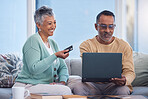 Couple, laptop and credit card for ecommerce, online shopping or transaction together at home. Elderly man and woman with smile for easy internet banking on computer relaxing on living room sofa