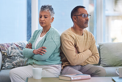 Buy stock photo Senior couple, angry and frustrated after fight with stress in marriage and conflict in relationship with divorce. Mature man with woman on living room couch and anger with silent treatment at home.