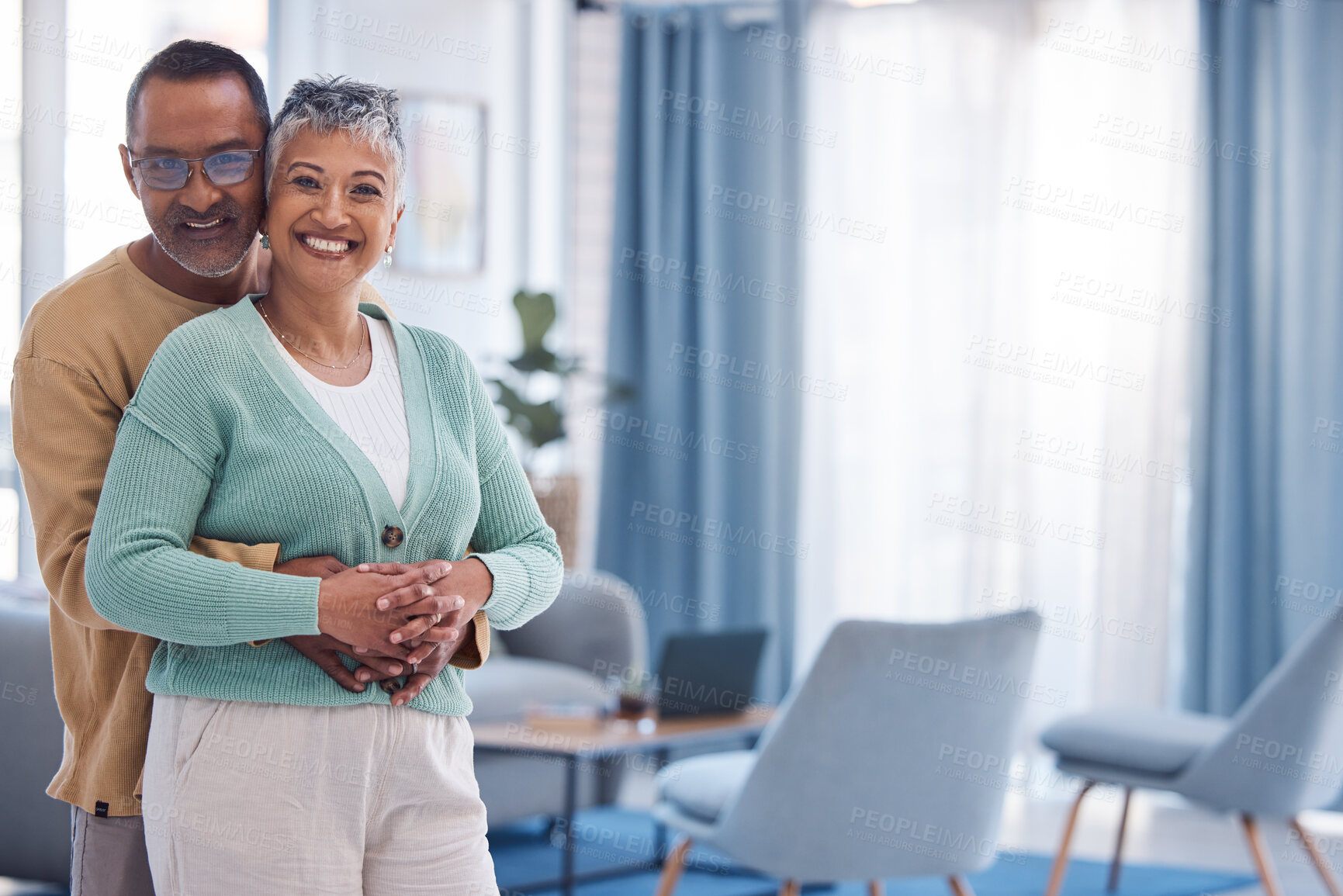 Buy stock photo Senior couple, love and hug with space in home living room with a smile, happiness and care portrait for marriage mockup. Portrait of a indian man and woman together for support in retirement