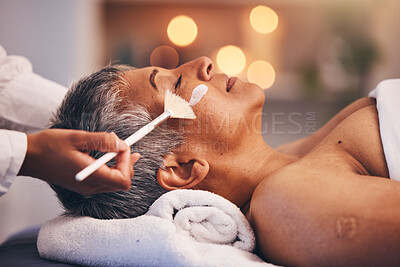Buy stock photo Spa, facial and senior black woman with mask for skincare, beauty and luxury treatment at beauty salon. Wellness, face massage and mature female relax on holiday, vacation and retirement at resort