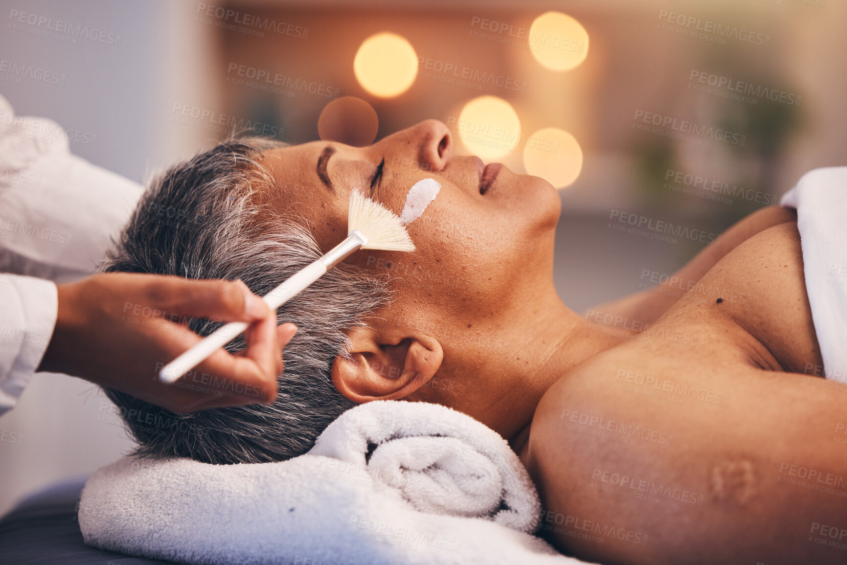 Buy stock photo Spa, facial and senior black woman with mask for skincare, beauty and luxury treatment at beauty salon. Wellness, face massage and mature female relax on holiday, vacation and retirement at resort