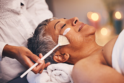 Buy stock photo Facial, relax and senior woman at a spa for a wellness, health and skin treatment at a resort. Peace, calm and elderly lady doing a luxury anti aging face mask with a therapist at a zen beauty salon.