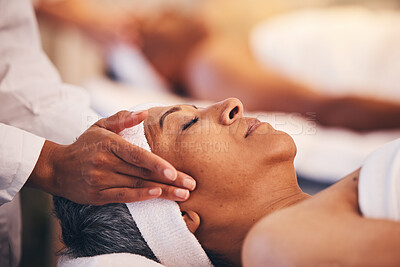 Buy stock photo Hands, head and massage with a woman in a spa for wellness or luxury treatment to relax and rest. Face, zen and stress relied with a senior female relaxing in a health salon for physical therapy