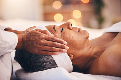 Buy stock photo Wellness, health and massage, senior woman at a spa getting luxury beauty therapy and facial. Mature black woman, zen and masseuse massaging oil on head to help relax body and mind for stress relief.