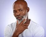 Portrait, face and thinking with a senior black man in studio on a purple background with an idea. Confidence, serious and mindset with an elderly male pensioner contemplating on a wall background