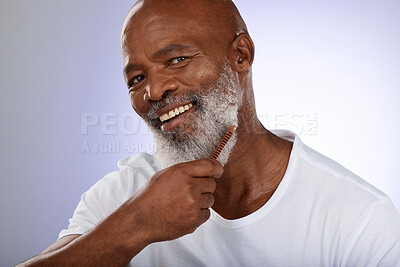 Buy stock photo Beauty, comb and beard with portrait of black man for barber, hair care and fashion. Smile, wellness and salon with face of old man and facial hair for hygiene, trimming and growth maintenance 
