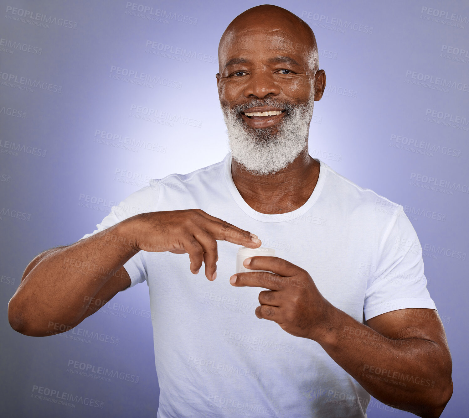 Buy stock photo Black man, mature face and skincare cream on purple studio background for dermatology, healthcare wellness or collagen treatment. Portrait, smile or happy middle aged model with facial beard product