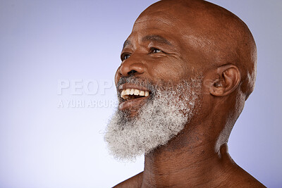 Buy stock photo Happy black man, face and skin with skincare mockup, smile with beard, elderly model and natural cosmetics with beauty and grooming. Cosmetic, wellness and facial with glow against purple background