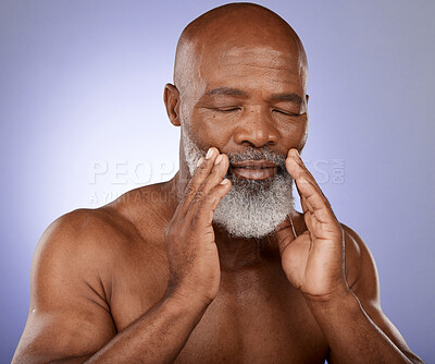 Buy stock photo Skincare, beauty and senior black man with dermatology cleaning, wellness and cosmetic peace against a purple studio background. Spa cosmetics, retirement body and face of elderly African model clean