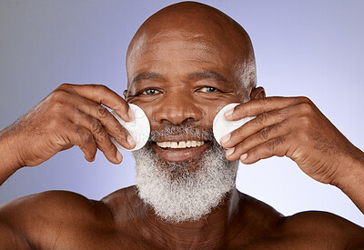 Buy stock photo Skincare, facial cotton and senior black man on purple background in studio for beauty, wellness and cosmetics. Luxury spa, dermatology and face portrait of elderly male with pads to cleanse skin