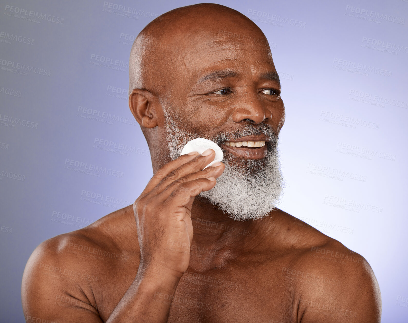 Buy stock photo Face cotton, skincare and senior black man in studio on purple background. Beauty, wellness and elderly male model from Nigeria with facial pad or product for hygiene, cleaning and grooming beard.