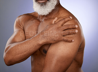 Buy stock photo Hand, arm pain and senior man in studio for injury, arthritis and joint ache on blue gradient background. Chest, elderly man and shoulder pain with mockup for heart attack, distress and cardiac sign