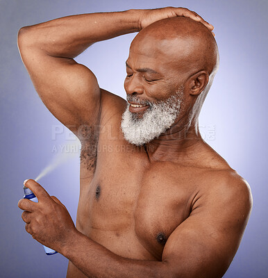 Buy stock photo Deodorant, grooming and senior black man with self care, hygiene beauty and spray against a purple studio background. Perfume, clean armpit and elderly African model with product for fresh body