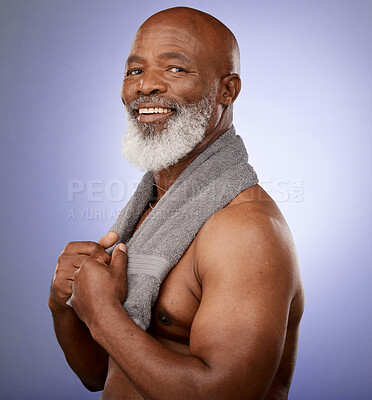 Buy stock photo African man, towel and portrait in studio for shower, wellness or skincare by purple backdrop. Happy black man, elderly model or cleaning for beauty, health or aesthetic by lavender studio background