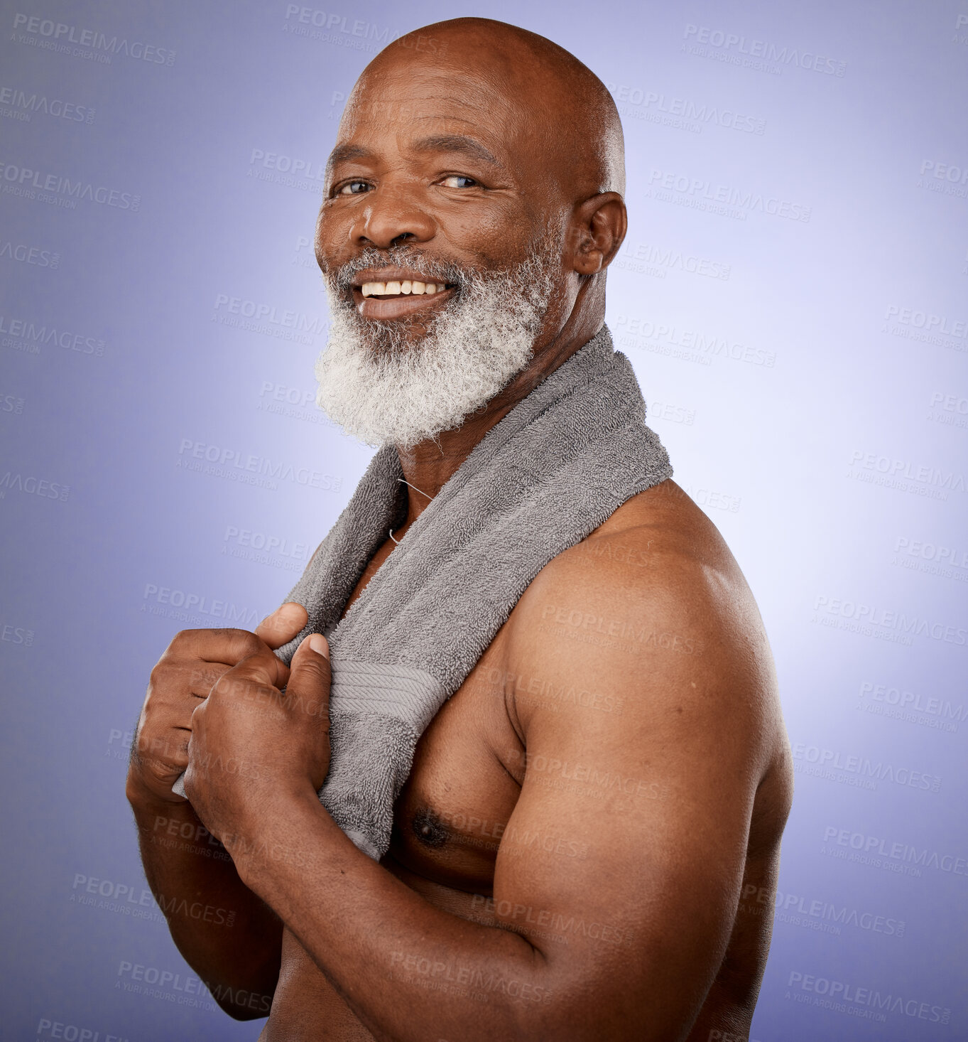 Buy stock photo African man, towel and portrait in studio for shower, wellness or skincare by purple backdrop. Happy black man, elderly model or cleaning for beauty, health or aesthetic by lavender studio background