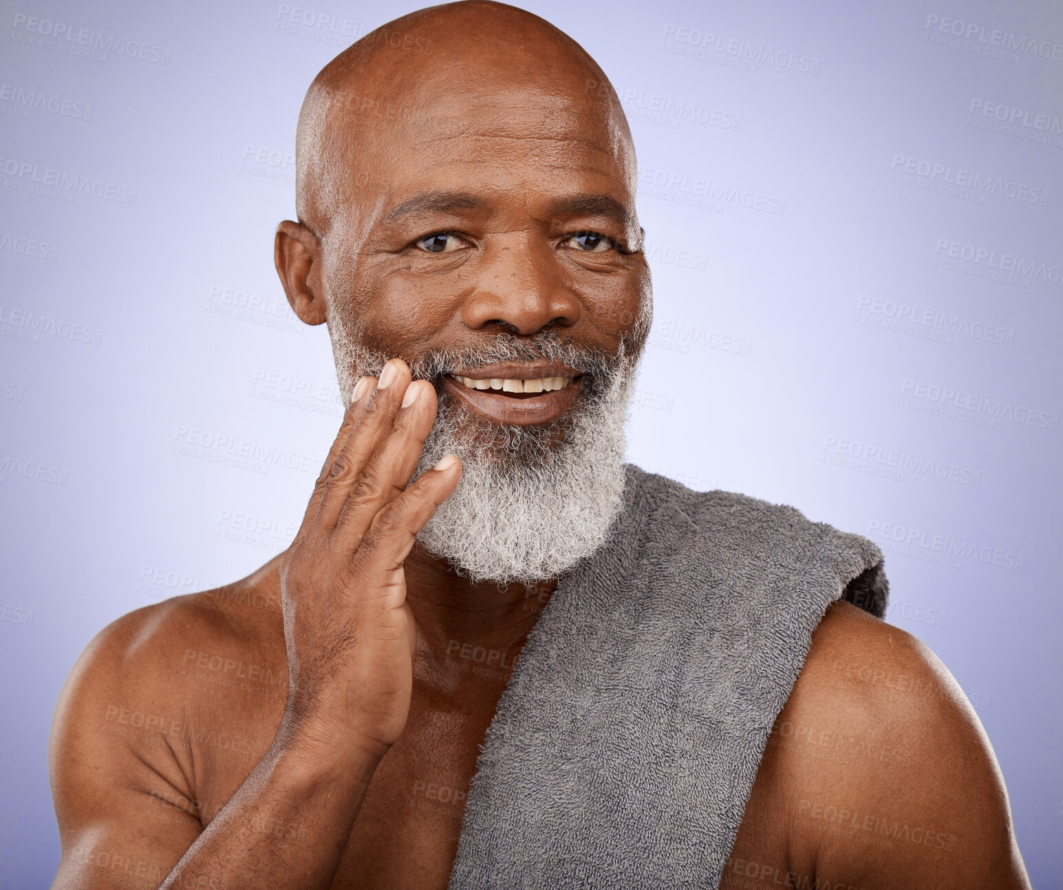 Buy stock photo Portrait, black man and towel for shower, healthy skincare and good personal hygiene on studio purple background. Mature guy touching clean face, body care cosmetics and male beauty, wellness and spa