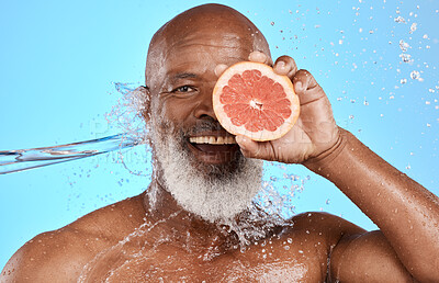 Buy stock photo Grapefruit, portrait and senior black man in studio with water splash for bathroom product, skincare and vitamin c health promotion. Smile face, fruit and an african elderly model  with facial glow