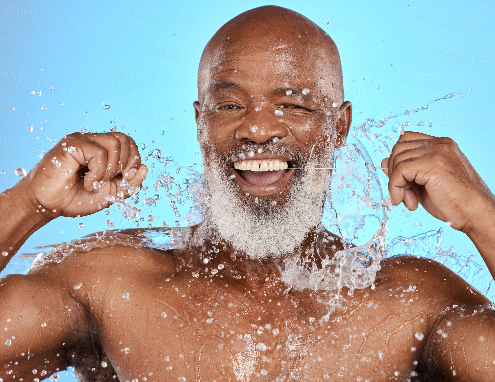 Buy stock photo Black man, water splash and flossing teeth for dental health, hygiene and wellness on blue studio background. African senior model with floss cleaning mouth for dentist, water and portrait mockup