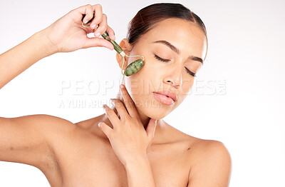 Buy stock photo Beauty, skin and face with woman and roller cosmetic tool, skincare and cosmetics with glow and shine against white studio background. Facial massage, self care and wellness with cosmetology mockup.