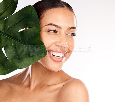 Buy stock photo Woman, face or skincare glow with plant in organic healthcare wellness, vegan dermatology or healthy Brazilian cosmetics. Smile, happy or beauty model with monstera leaf on studio background mock up
