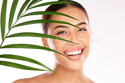 Buy stock photo Leaf, woman and beauty, natural skincare and cosmetics from plants for wellness, glow and sustainability on studio background. Portrait of happy model face, green leaves and eco friendly dermatology