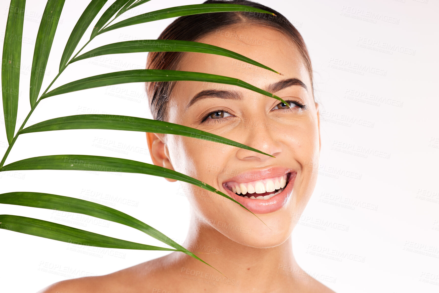 Buy stock photo Leaf, woman and beauty, natural skincare and cosmetics from plants for wellness, glow and sustainability on studio background. Portrait of happy model face, green leaves and eco friendly dermatology