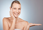 Portrait, beauty and woman with skincare mockup for facial product placement, marketing or advertising on background. Hand, face and happy model in studio with dermatology cosmetics branding space 