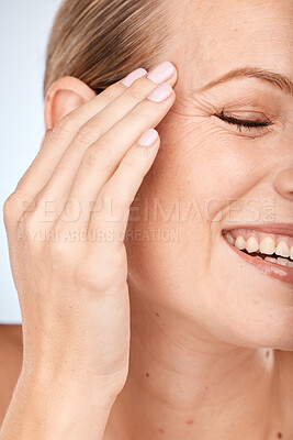 Buy stock photo Woman hand, face and skincare glow on studio background in anti aging wellness, wrinkles management or dermatology healthcare. Zoom, smile or happy beauty model, makeup cosmetics and relax healthcare