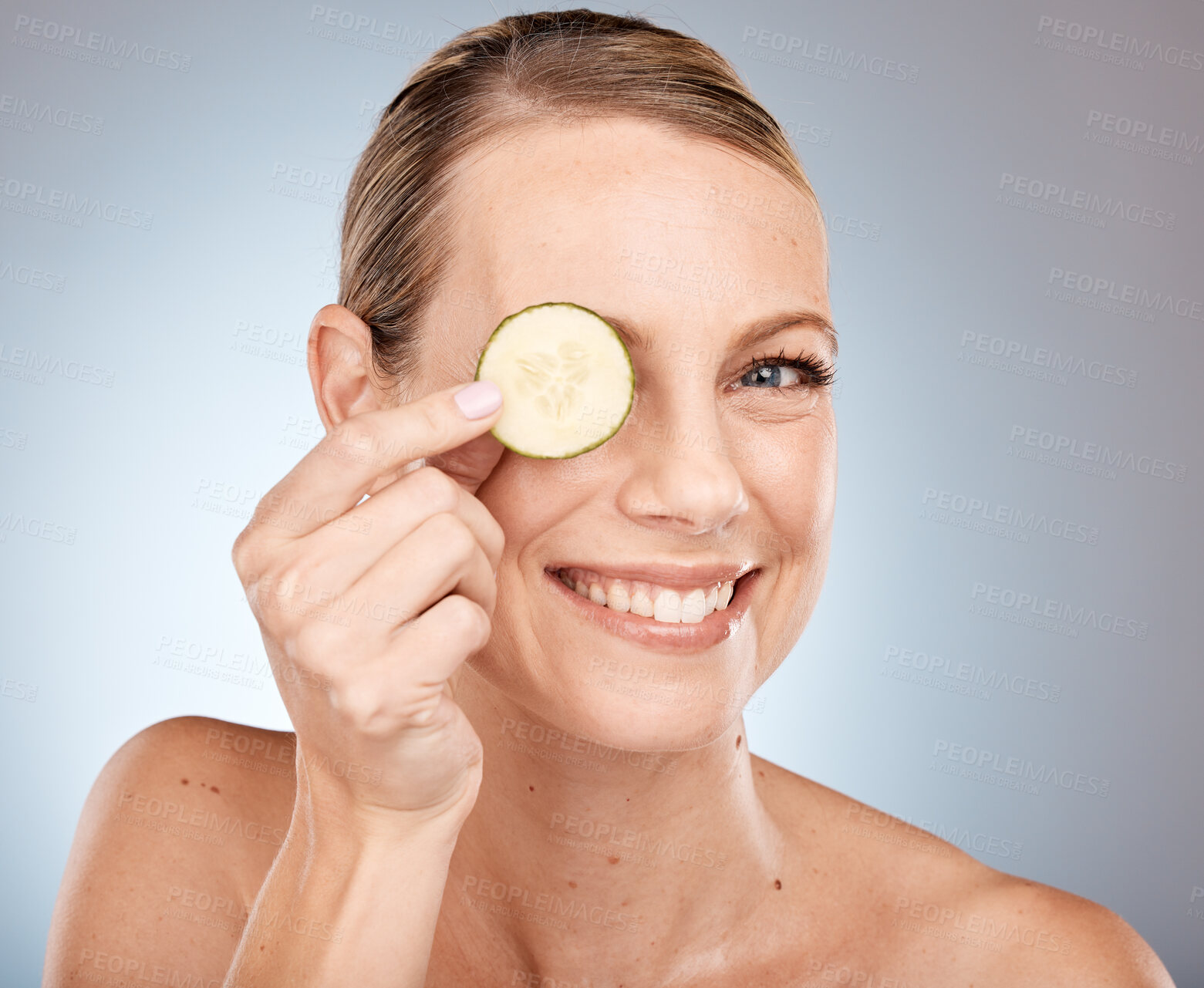 Buy stock photo Cucumber eye and skincare portrait of woman with healthy, fresh and clean face satisfaction. Self love, wellness and skin detox model with natural beauty smile on gray studio background.