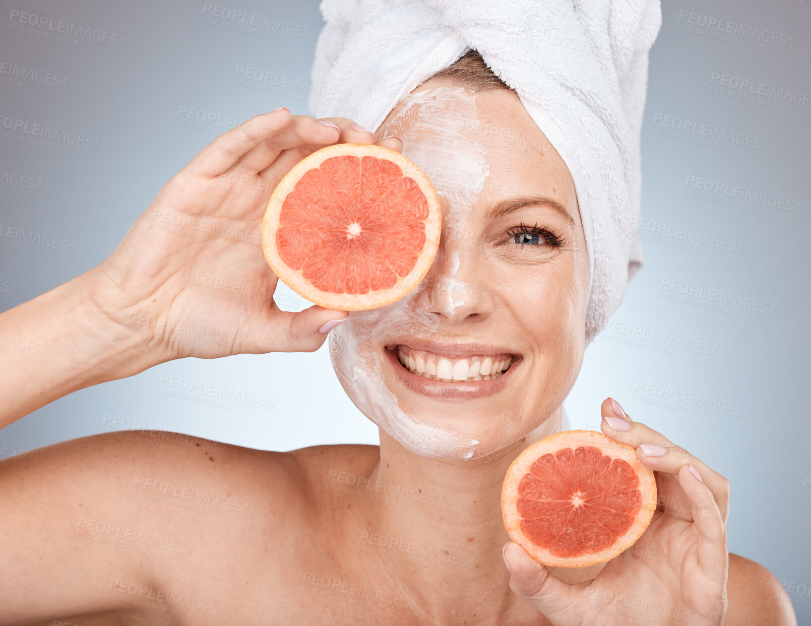 Buy stock photo Woman, face mask or grapefruit skincare on studio background in Canada healthcare wellness, organic dermatology or vegan facial. Portrait, smile or happy beauty model with citrus fruit facial product