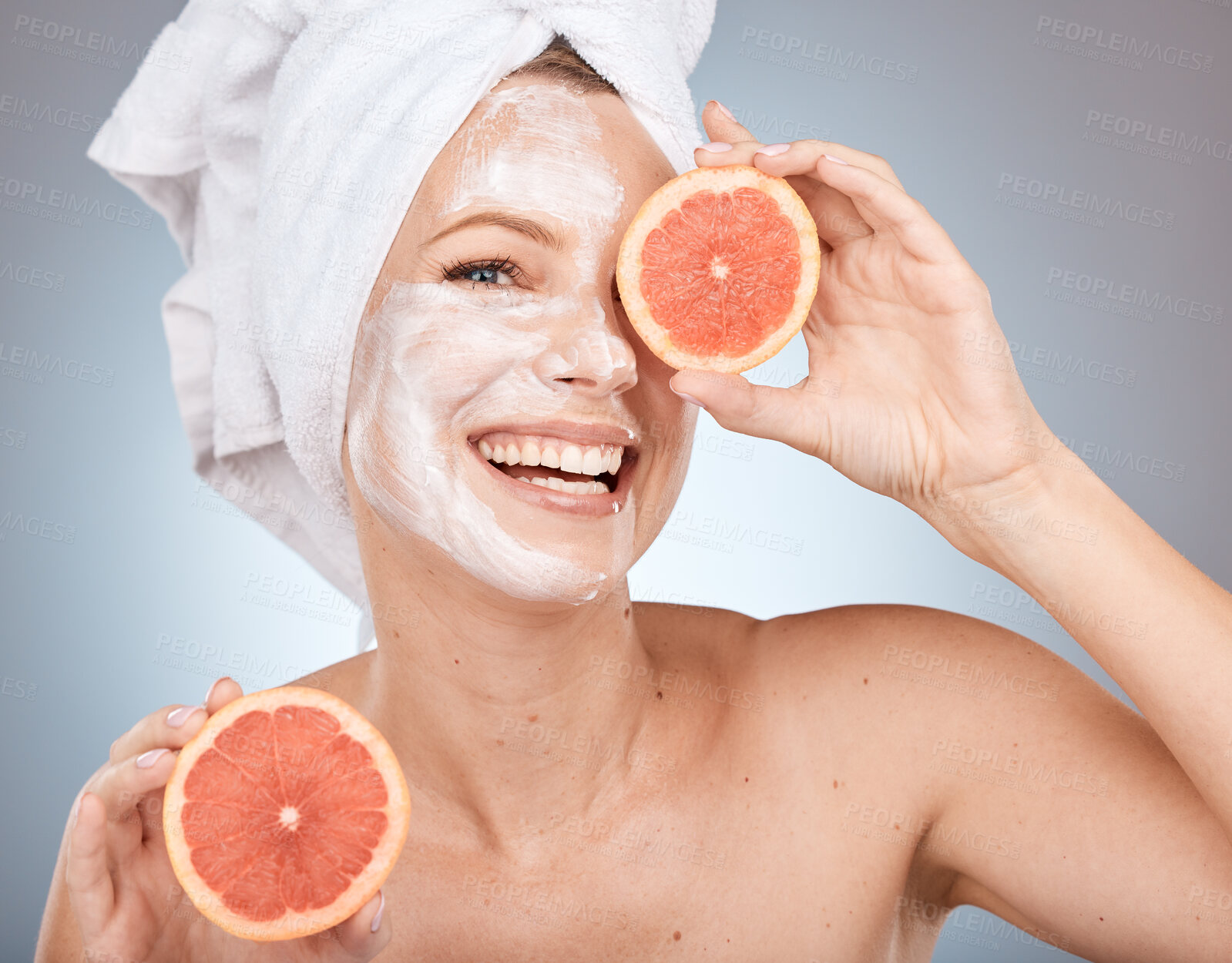 Buy stock photo Skincare, grapefruit and portrait of a woman in studio with face cream, lotion or spf for skin routine. Health, wellness and model with citrus fruit for organic, natural and healthy facial treatment.