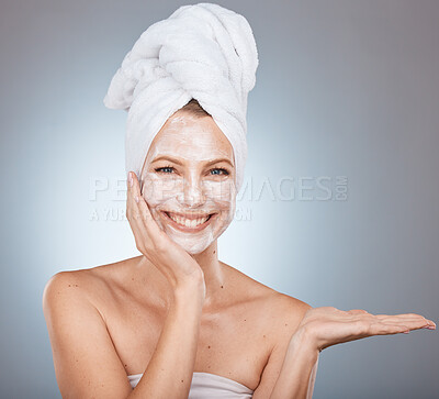 Buy stock photo Woman portrait and face mask after a shower for skincare, beauty and health on a grey studio background. Skin care, mask for glowing skin on a female for cosmetic and dermatology wellness